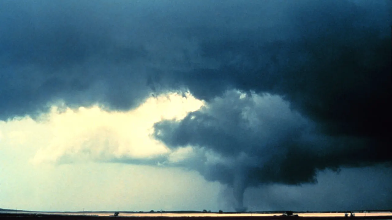 Tornado over open farm fields