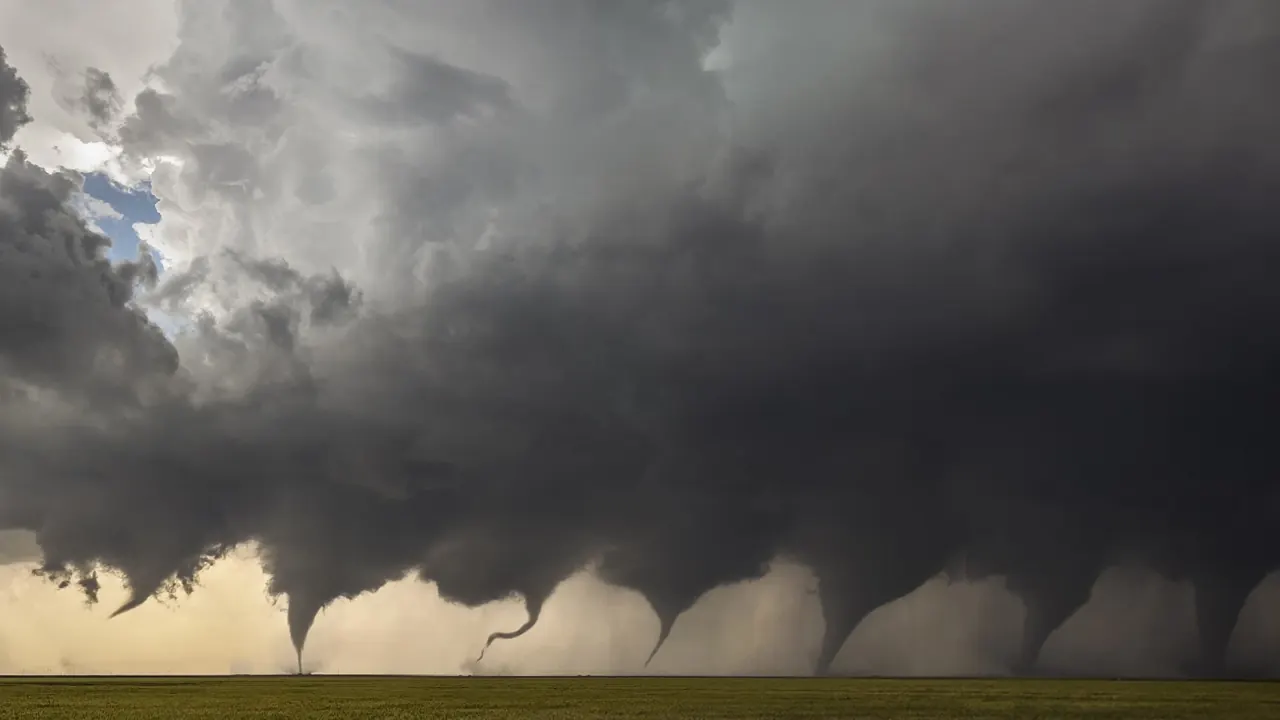 A tornado forming beneath a storm