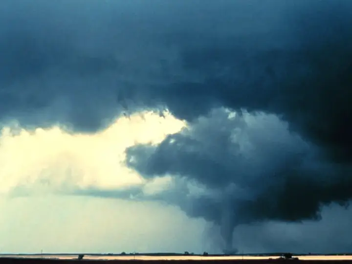 Tornado over open farm fields