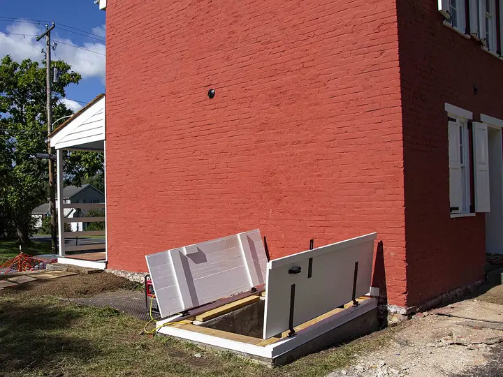 Brick house with steel storm cellar doors