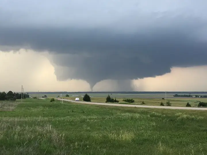 Tornado crossing farmland in the Midwest